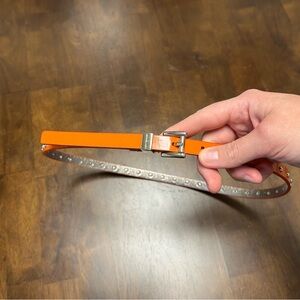 MICHEAL KORS Orange belt with silver studs 5 holes 1/2 inch thick Size S